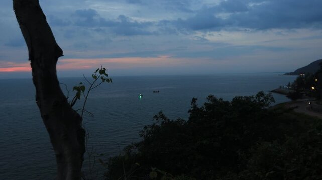 The video background depicts the waterfront, with twilight sky illuminating the riverside community and the lights from houses, reflecting the rural lifestyle of Chanthaburi, Thailand.