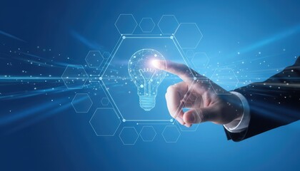 Businessman's finger touching a glowing lightbulb icon on a digital network interface hand idea