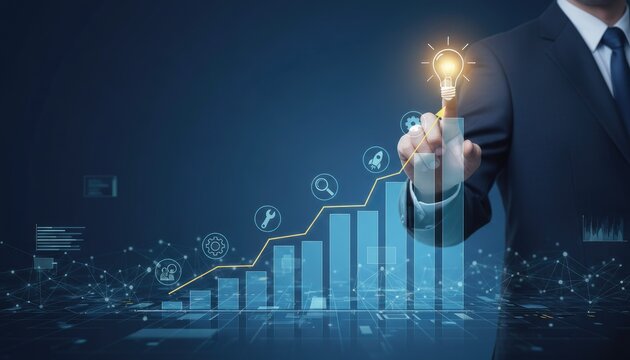 Businessman's hand touching a glowing lightbulb above a rising bar graph with digital icons and network connections - Powered by Adobe
