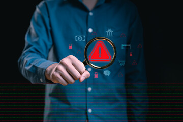 Professional man holds a magnifying glass over a glowing red exclamation mark alert icon, binary code and financial cyber, serious risk analysis, data security threat, and fraud investigation