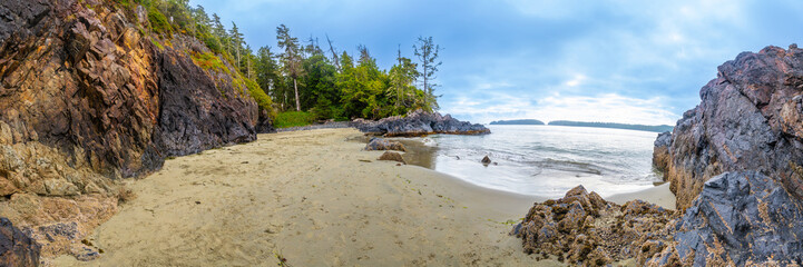 Panoramic view of mackenzie beach embracing the pacific ocean in tofino, vancouver island