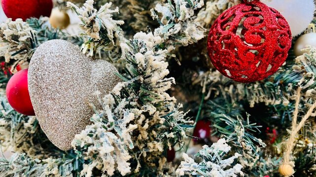 Full frame close-up of assorted Christmas baubles and decorations on a Christmas tree