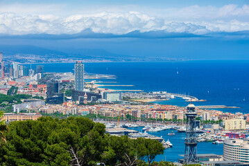 Aerial view of Barcelona coastline with La Barceloneta and Port de Barcelona, Mediterranean Sea, Catalonia, Spain. Cityscape of Barcelona.
