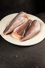 Hake raw fish seafood healthy food main course ingredient appetizer fresh delicious gourmet food table setting rustic food top view copy space pescatarian diet