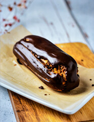 Chocolate Éclair Pastry with Cream Filling for Premium Dessert Food Object and Bakery Concept