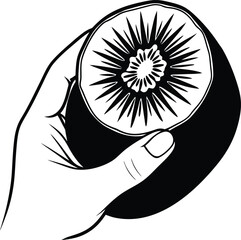 Hand holding a sliced kiwi fruit with starburst pattern