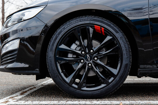 January 3, 2022, Seoul, South Korea - A close-up of the front wheel and Continental tire on a black Chevrolet Malibu sedan.