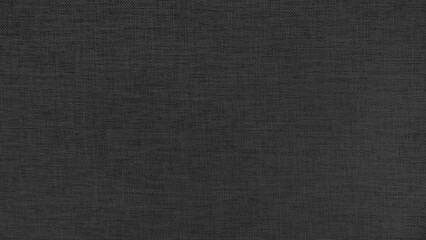 ฺBlack linen fabric texture background. High resolution close up of natural woven textile surface. Black canvas material pattern for abstract wallpaper or furniture upholstery design.