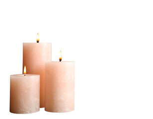 Set of three elegant pink candles with flames