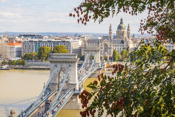 Budapest city framed by trees over the Danube river - Hungary