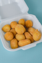 Appetizer set - coxinha and cheese balls with bright props