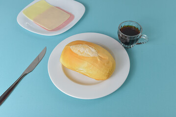 Brazilian bread pao frances on a minimalist table setting