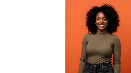 Smiling Portrait: A confident and beautiful woman radiates positivity against a vibrant orange backdrop, her genuine smile and captivating gaze captivate the viewer.