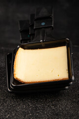 Raclette cheese portion slicing natural product tasty snack fresh delicious gourmet food background on the table rustic top view copy space