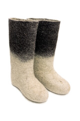 Felt boots with a light bottom and dark top on a white background