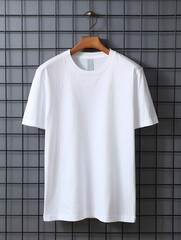 Plain white tshirt mockup hanging on a hanger against grid wall