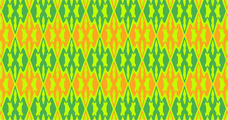 Colorful seamless zigzag and abstract ethnic pattern in green yellow and orange tones, vibrant decorative background for textile, fabric, wallpaper, and surface design.