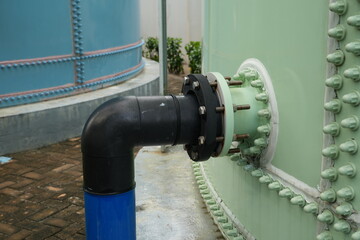 Industrial pipeline connection showing robust infrastructure and engineering systems for water...