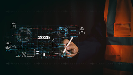 Industrial engineer using stylus on 2026 virtual interface with maintenance icons. Digital transformation in construction and smart factory technology concept for future work planning.