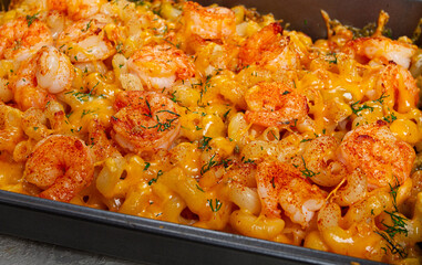 pasta with shrimp and cheese, with a golden crust, cooked in a baking dish, homemade, no people,