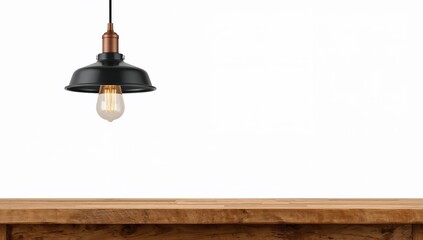 Minimalist industrial pendant lamp hanging above wooden table with blank white background for modern interior design