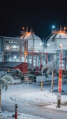 Industrial plants with large chemical storage tanks.