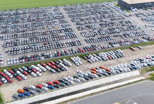 Fototapeta Aerial view of a storage facility for new cars