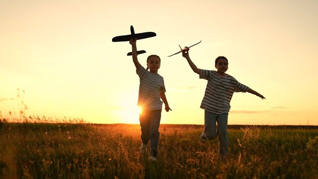 child airplane, children dream airplane pilot, child kid boy girl running with toy airplane across field, working team pilots, silhouette happy children running with toy airplanes hands, happy boy