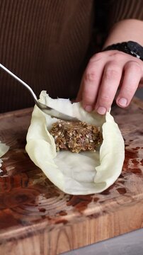 Wrapping meat in cabbage