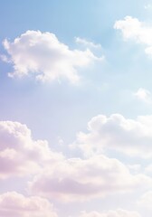Obraz premium A gentle pastel blue sky filled with soft white clouds creating a peaceful, tranquil and serene background texture for extensive copy space ,light ,gradient ,simple