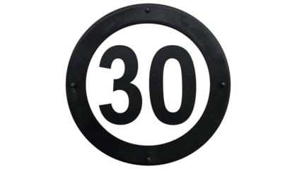 A dark, weathered circular sign indicates a speed limit of thirty