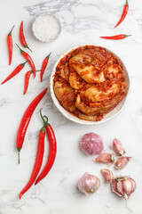 Kimchi is a dish of Korean cuisine made of cabbage and pickled (fermented) vegetables with red hot pepper and garlic. Close-up, selective focus