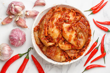 Kimchi is a dish of Korean cuisine made of cabbage and pickled (fermented) vegetables with red hot pepper and garlic. Close-up, selective focus