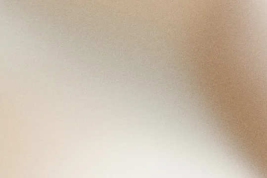 Soft beige and brown gradient background creating subtle texture with analog film grain effect
