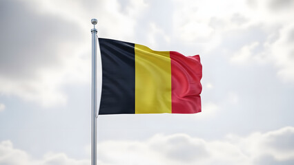 The national flag of Belgium, featuring vertical black, yellow, and red stripes, proudly waves against a bright, cloudy sky.