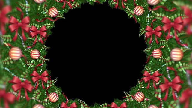 circular ring of pine branches forms a traditional holiday door decor. Striped ornaments and red ribbons accent the green wreath.