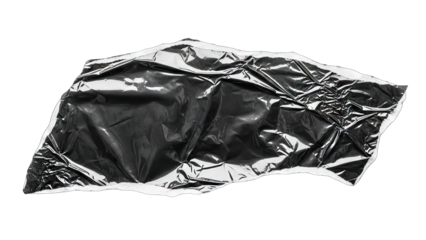 Wrinkled black plastic bag texture isolated on white background.