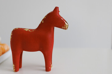 Red Wooden Horse Toy on Minimal Background