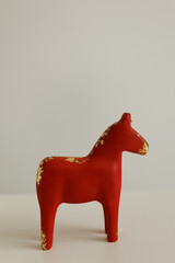 Red Wooden Horse Toy on Minimal Background