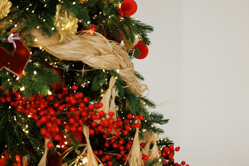 Elegant Christmas Tree Decorated with Red Berries and Ornaments