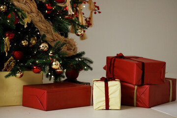 Christmas Tree with Wrapped Gifts and Festive Decor