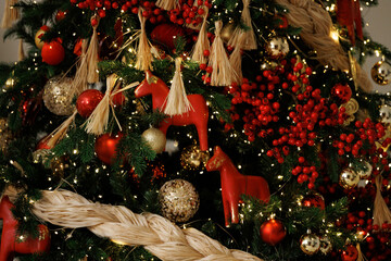 Elegant Christmas Tree Decorated with Red Berries and Ornaments
