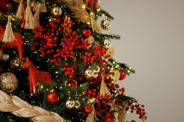 Elegant Christmas Tree Decorated with Red Berries and Ornaments