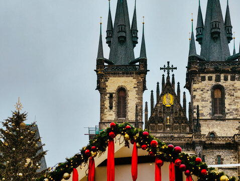 Christmas Market Decorations with Historic Gothic Church Towers in Prague Old Town Square Holiday Background 