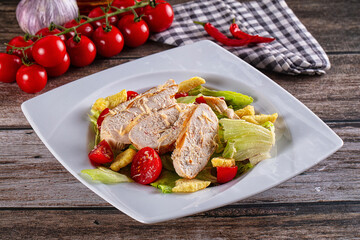 Salad caesar with chicken and croutons