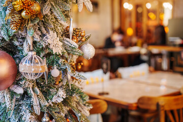 A Christmas tree at the restaurant and romantic evening decorations