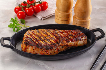 Grilled pork steak with bone