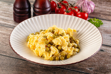 Scrambled egg omelet with green peas