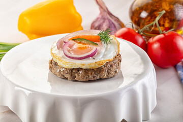 Beefsteak chop with roasted egg