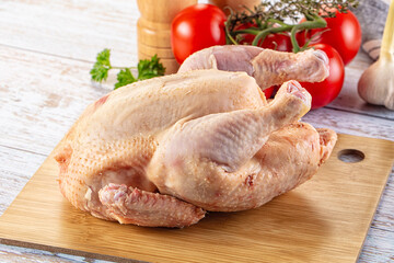 Raw whole uncooked organic chicken